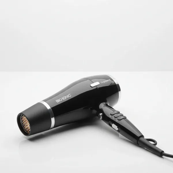 Close-up of the Bio Ionic GrapheneMX Professional Dryer highlighting its sleek design and advanced features on a clean background.