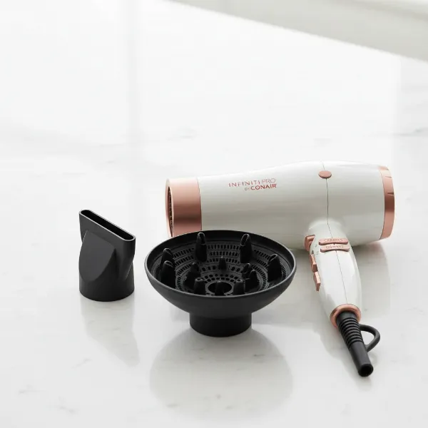 Conair Infiniti Pro hair dryer with concentrator nozzle and diffuser attachments.